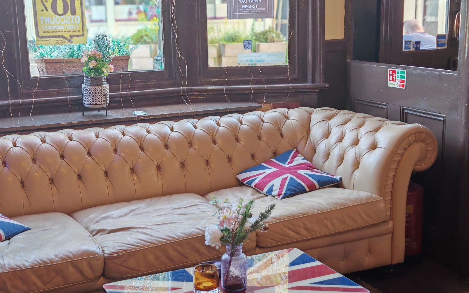 a low-ceilinged pub interior, warm light